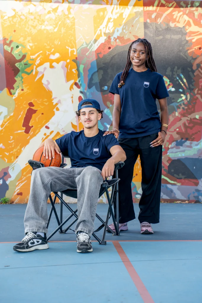 Young people wearing T-shirts and caps from Decathlon's charity line and Sport dans la Ville